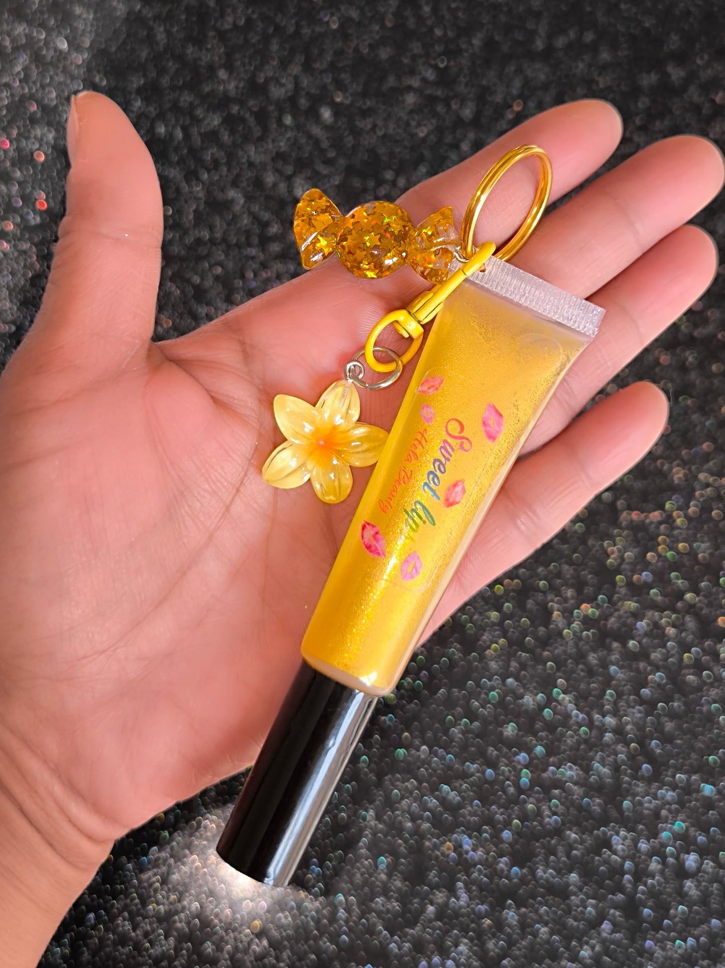 PORTE CLÉ HUILE À LÈVRES SCINTILLANTE GOLD FLOWER 🌼